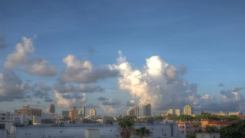 Clouds race over cityscape time lapse Stock Footage 125790542