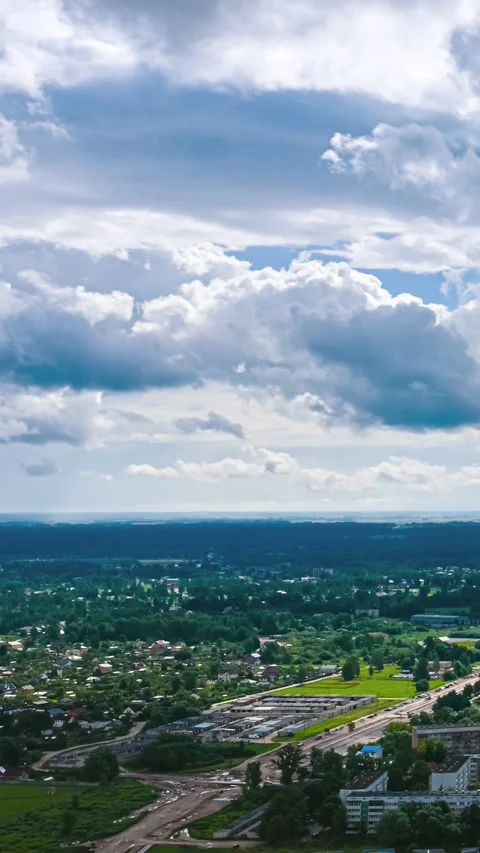 Clouds Racing Above Suburb and Data Center Construction Along Rural Road Stock Footage 337649270