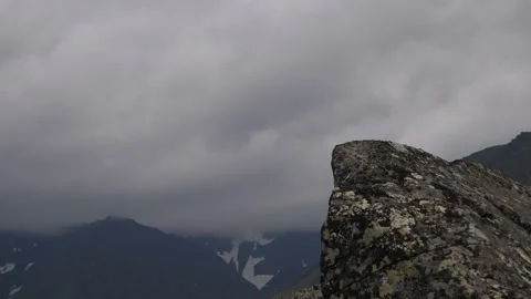 Clouds rapidly move behind the cliff. Timelapse. Subpolar Ural. Uralic Mountains Stock Footage 269139986