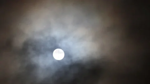 Clouds rapidly moving against a full moon in the windy autumn night Stock Footage 33917805