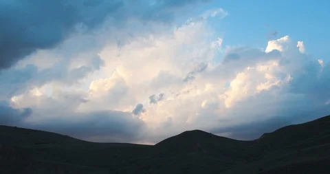 Clouds in the rays of the sun go over the hill Stock Footage 90504149