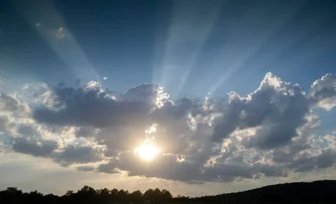 Clouds with rays of sunlight in the sky Stock Photos