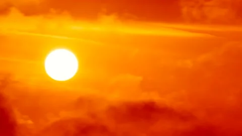 Clouds, red golden sky and white sun at sunrise - sky background - Time Lapse Stock Footage 152563382