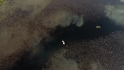 Clouds Reflect off Peaceful Lake as Camera Rotates around Fishermen Casting Stock Footage 201484820
