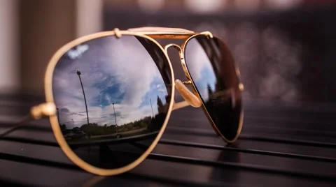 Clouds reflect in Sunglasses Timelapse Video stock 60693886