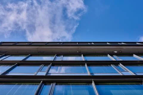Clouds reflected in buildings Stock Photos
