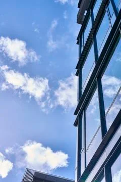 Clouds reflected in buildings Stock Photos