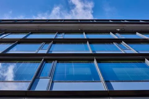 Clouds reflected in buildings Stock Photos