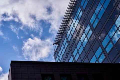 Clouds reflected in buildings Stock Photos