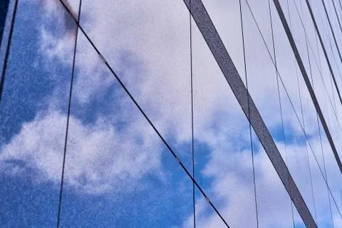 Clouds reflected in buildings Stock Photos