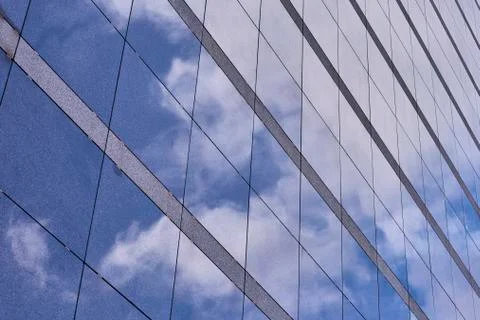 Clouds reflected in buildings Stock Photos