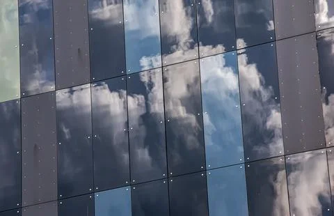 Clouds Reflected in Dark Glass Facade Panels Stock Photos