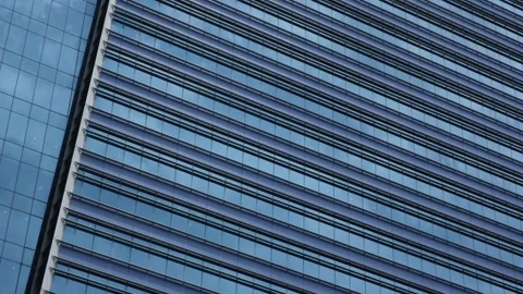 Clouds Reflected In A Full Frame, Abstract View Of An Office Building Stock Footage 145239912