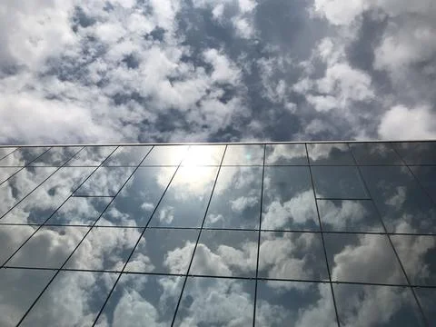 Clouds reflected in glass building 스톡 사진