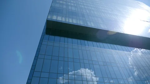 Clouds reflected from a glass skyscraper Stock Footage 107657943