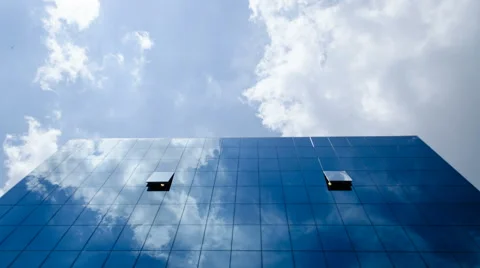 Clouds Reflected In A Modern Office Glass Building Stock Footage