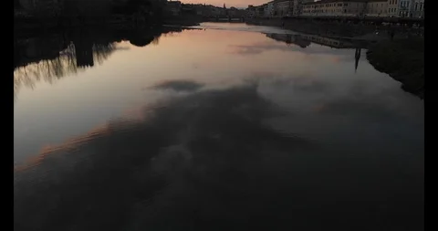 Clouds reflected over the Arno river at sunset. Stock Footage 125705132