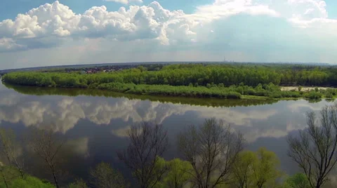 Clouds reflected in a river. Aerial view. Video stock 37395971
