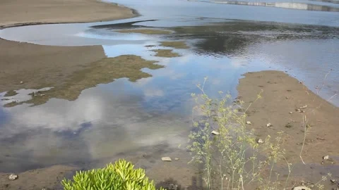 Clouds reflected in the river Landro in Viveiro, Spain Stock Footage 249361059