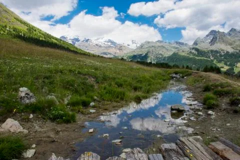 Clouds reflected in a river Фото