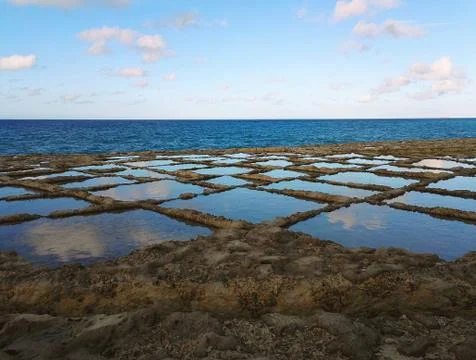Clouds reflected in the salt flats Stock Photos