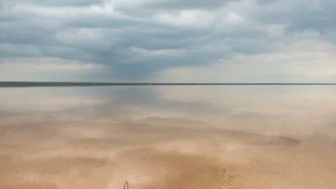 Clouds reflected in the smooth water of the yellow water. Stock Footage 142563412
