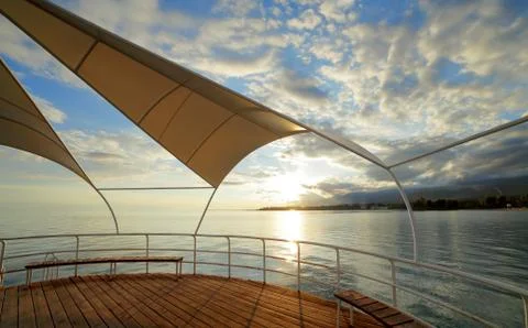 Clouds reflected on the water during sunset Stock Photos