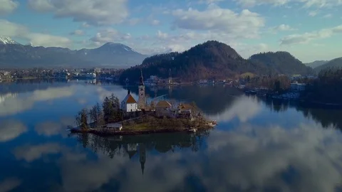 Clouds reflected on the water. Mountain lake Bled in December. Stock Footage 101325555