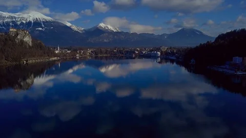 Clouds reflected on the water. Mountain lake Bled in December. Stock Footage 101325718