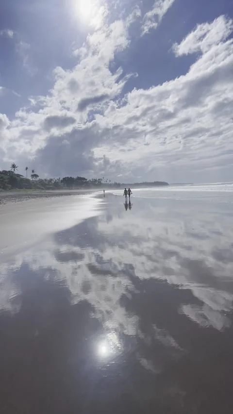 Clouds reflected in the water surface on the ocean shore Video stock 283816539
