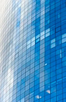 Clouds Reflected in Windows of Modern Office Building Stock Photos