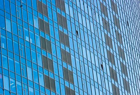 Clouds Reflected in Windows of Modern Office Building Stock Photos