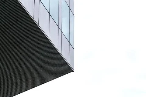 Clouds reflected in windows of modern office building. Stock Photos