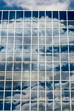 Clouds reflected in windows Stock Photos