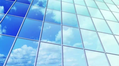 Clouds reflected in windows of skyscraper loop Stock Footage 11878301