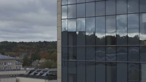Clouds reflecting in business center building in Vilnius city center Stock Footage 218416522