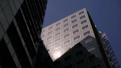 Clouds reflecting onto the glass of a large office building. Stock Footage 132447803