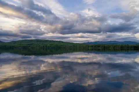 Clouds reflecting in lake Funasdalssjon Stock Photos
