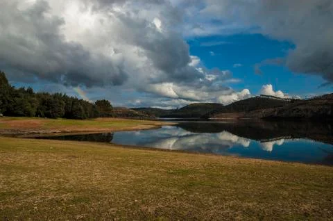 Clouds reflecting in a lake Stock Photos