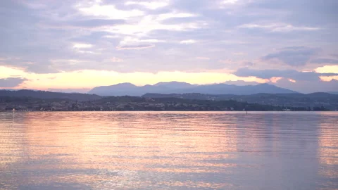 Clouds reflecting on lake surface at sunset Stock Footage 287820455