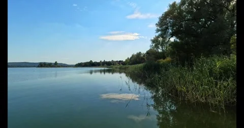 Clouds reflecting on the lake water Stock Footage 315415879