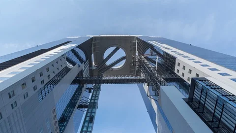 Clouds reflecting in a modern building in Osaka, Umeda Sky. Looking up. Stock Footage
