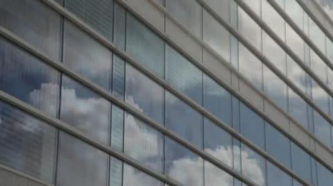 Clouds reflecting off office windows Stock Footage 12192431