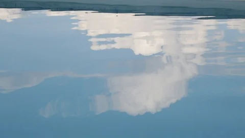 Clouds reflecting on pool water Stock Footage 93781141