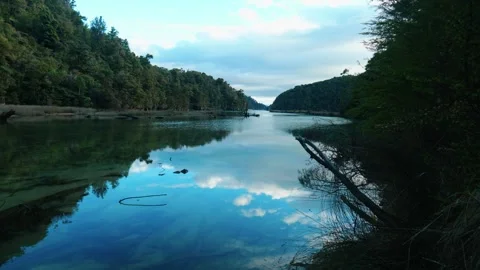 Clouds reflecting on a river in the morning 스톡 동영상 260367526