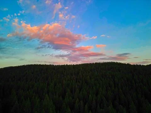 Clouds reflecting the setting sun in Flathead National Forest. Stock Photos