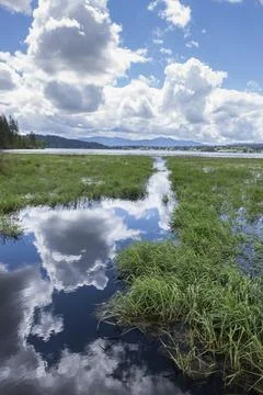 Clouds reflecting off the water. Stock Photos