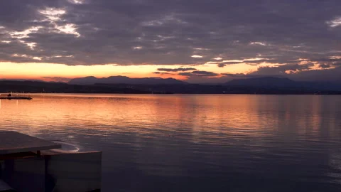 Clouds reflecting on water surface at sunset Stock Footage 287821299