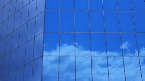 Clouds reflection on a glass facade - modern office Building - time lapse Stock Footage 63970433