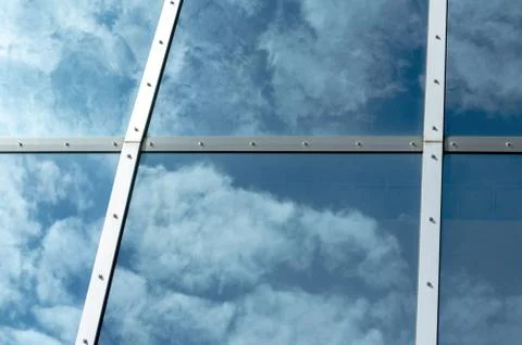 Clouds reflection on a glass Stock Photos